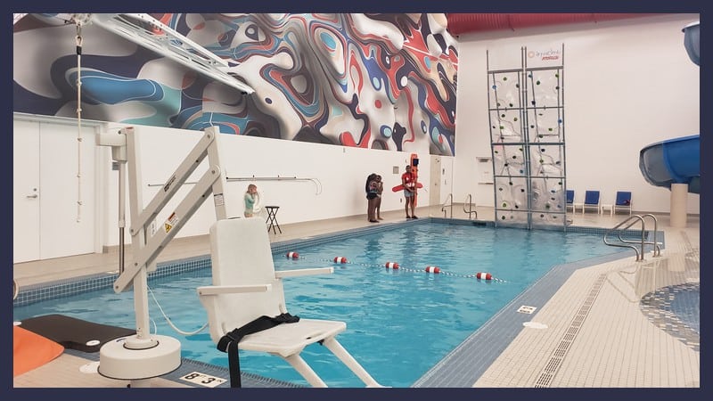New Farmington Hills Indoor Pool at The Hawk Aquatics Center 3 rock wall and zip line at The Hawk pool